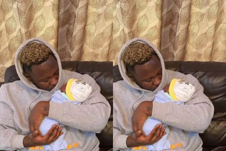 Medikal poses with Baby Girl Island Frimpong in First Public Photo