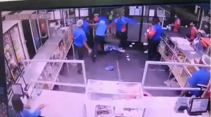 Employees of a company caught on CCTV beating up a man and his friend for being disrespectful (Video)