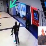Security man calmly walks away as armed men rob a man at the ATM (Video)