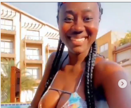 Hajia Bintu flaunts her raw chest in hot swimwear as she goes swimming