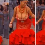 Bride leave guests speechless ; flaunts her huge melons in ‘free show’ dress [video]