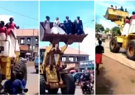 Drama as a newlywed couple and their bridesmaids are ferried in a loader [video]