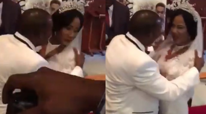 Bride angrily pushes her groom as he tries kissing her during their wedding (Video)