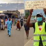Man takes to the street with placard to sell his kidney to send his younger brother to school