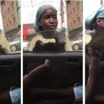 Child beggar rejects bundle of money offered to her by young man in a car (Watch video)