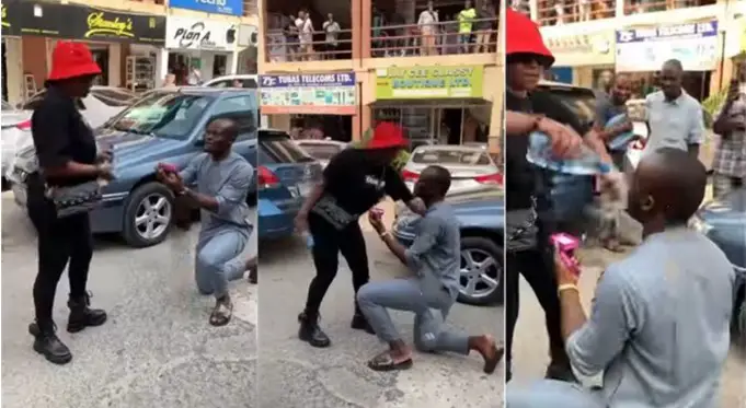 Lady angrily pours water on boyfriend in Abuja for embarrassing her by proposing in public (Video)