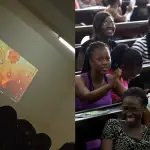 University Lecturer Projects Laptop with Photo of Class Rep Used as Screen Display
