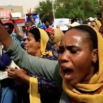 Sudanese women and girls take to the streets of Khartoum as they join ongoing protests against military rule on July 6