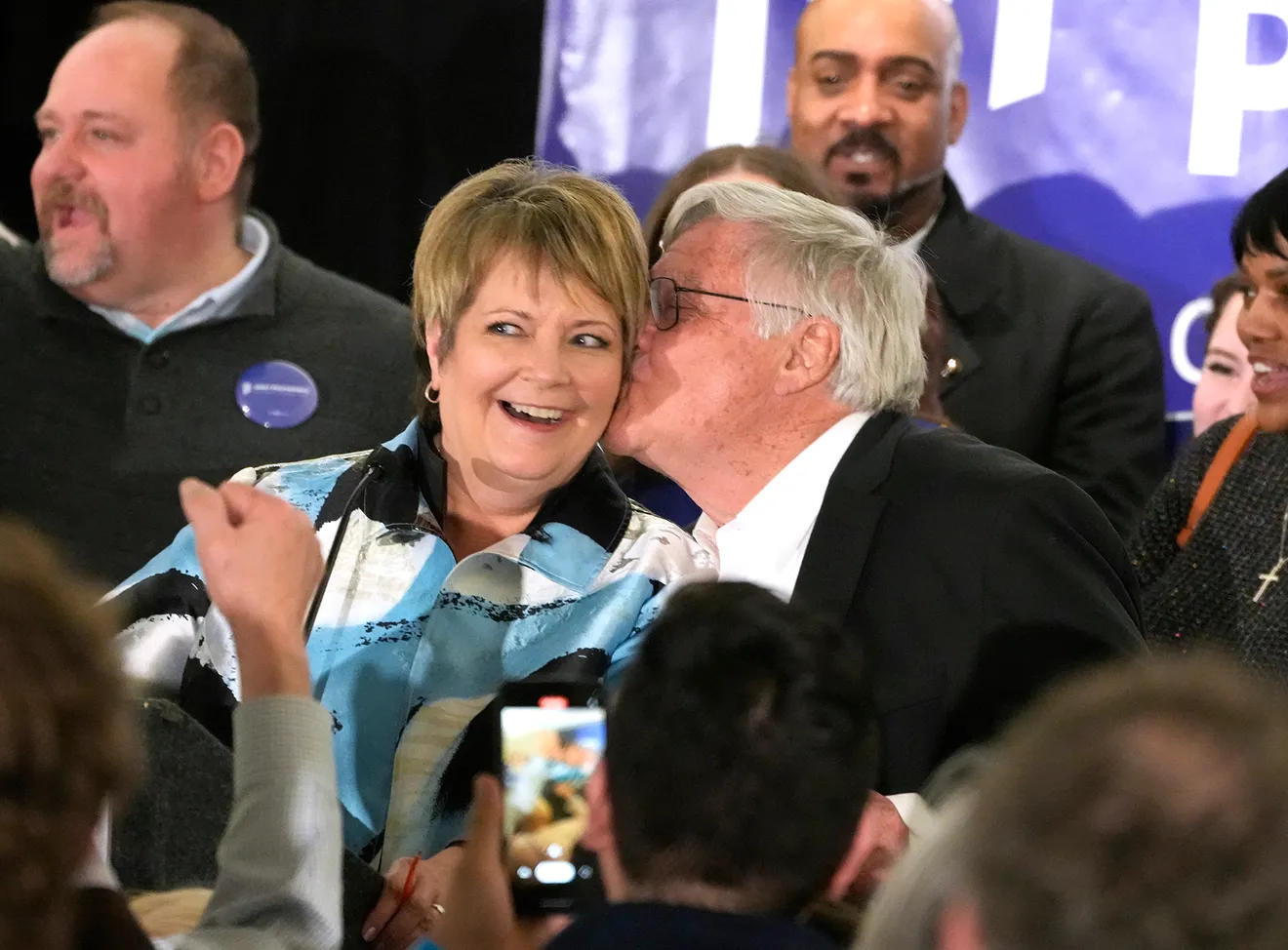 Gregory Sell gives his wife Janet Protasiewicz a kiss during her election night
