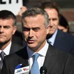 Dominion CEO John Poulos, joined by members of the Dominion Voting Systems legal team, speaks outside the Leonard Williams Justice Center in Wilmington, Delaware, on April 18. (Andrew Caballero-Reynolds/AFP/Getty Images)