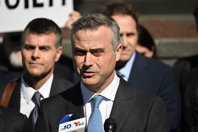 Dominion CEO John Poulos, joined by members of the Dominion Voting Systems legal team, speaks outside the Leonard Williams Justice Center in Wilmington, Delaware, on April 18. (Andrew Caballero-Reynolds/AFP/Getty Images)